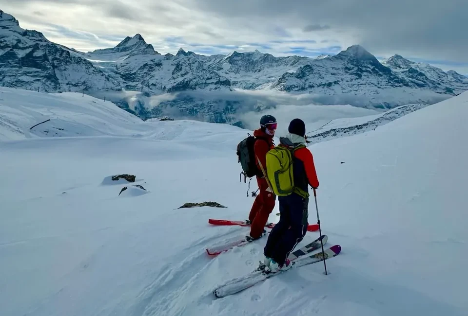 2 skiers atop Grindelwald, Jungfrau region